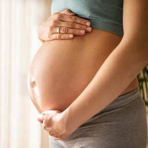qué es epi-no mujer embaraza sujeta barriga